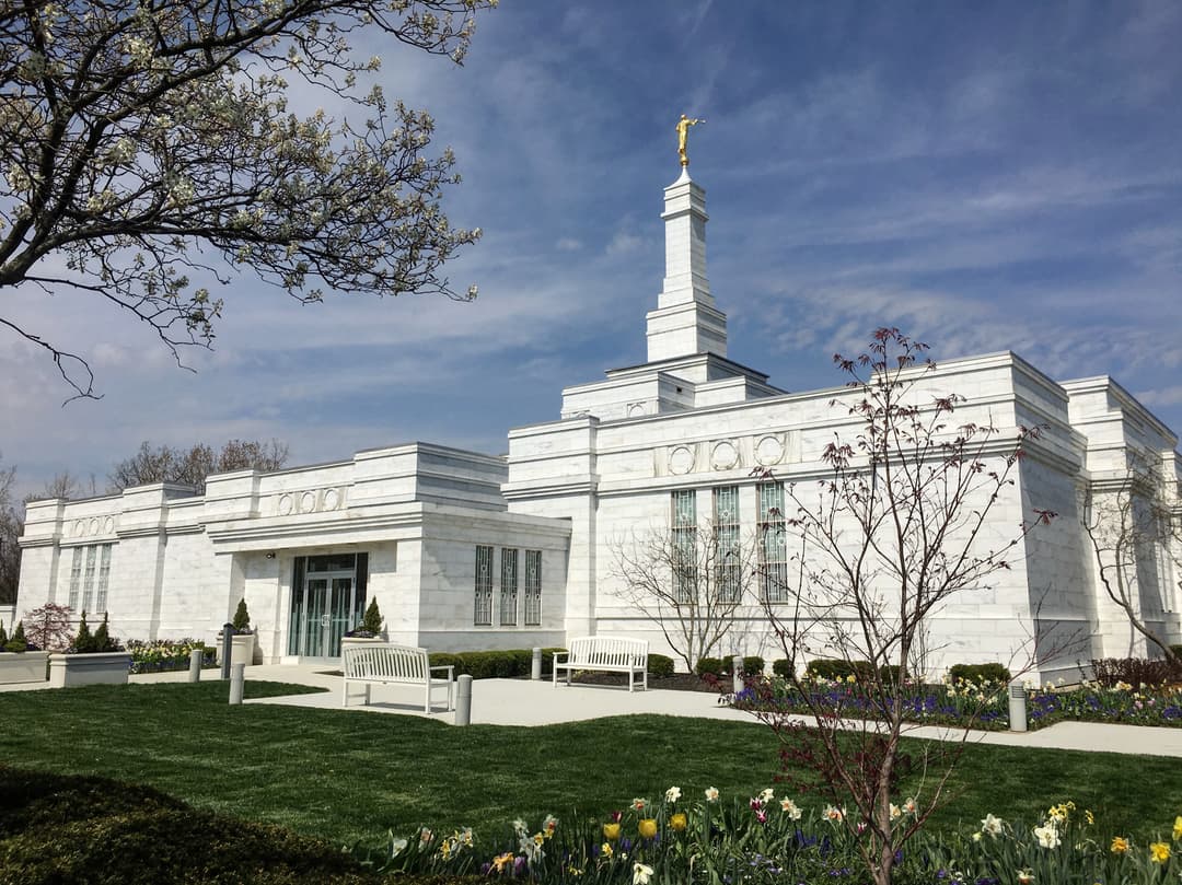The Columbus Ohio Temple facade and spire on a sunny spring day.