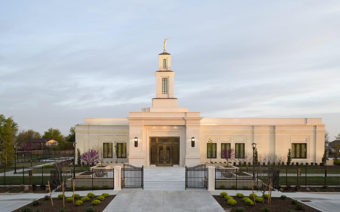 Front exterior of Oklahoma City Oklahoma Temple at twilight with spire.