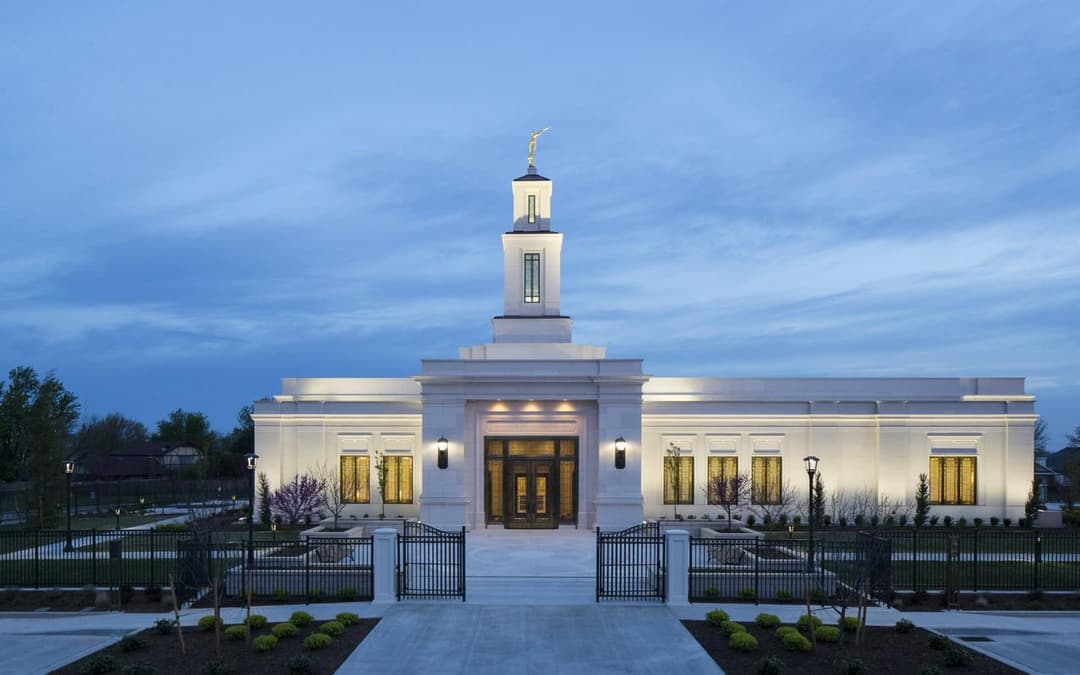 Oklahoma City Oklahoma Temple at twilight, showing front entrance and spire.