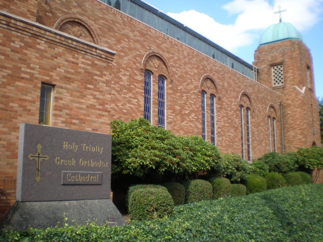 Cathedral sign and exterior brick facade with domed tower