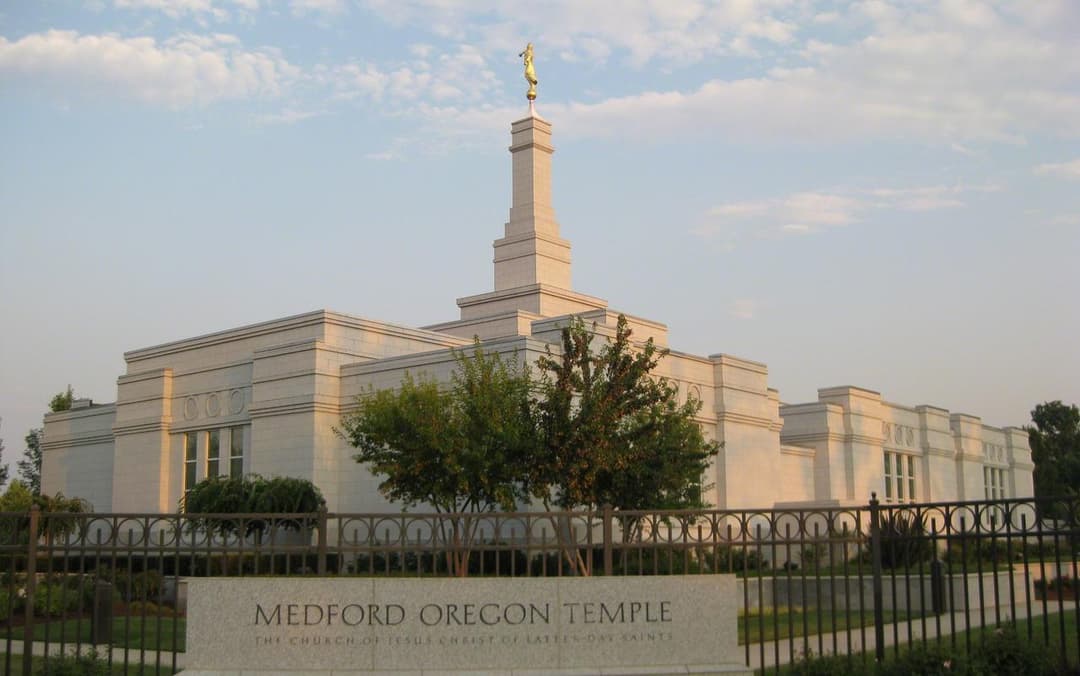 Medford Oregon Temple exterior at late afternoon, with spire and Moroni.
