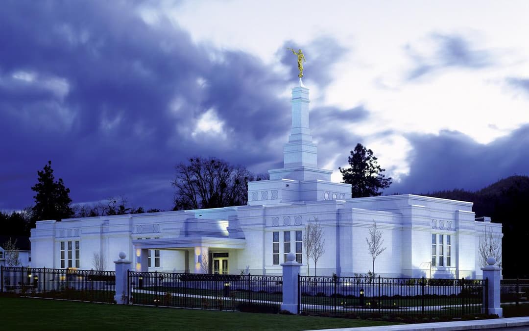 Medford Oregon Temple at twilight, wide shot, with spire and Moroni statue.