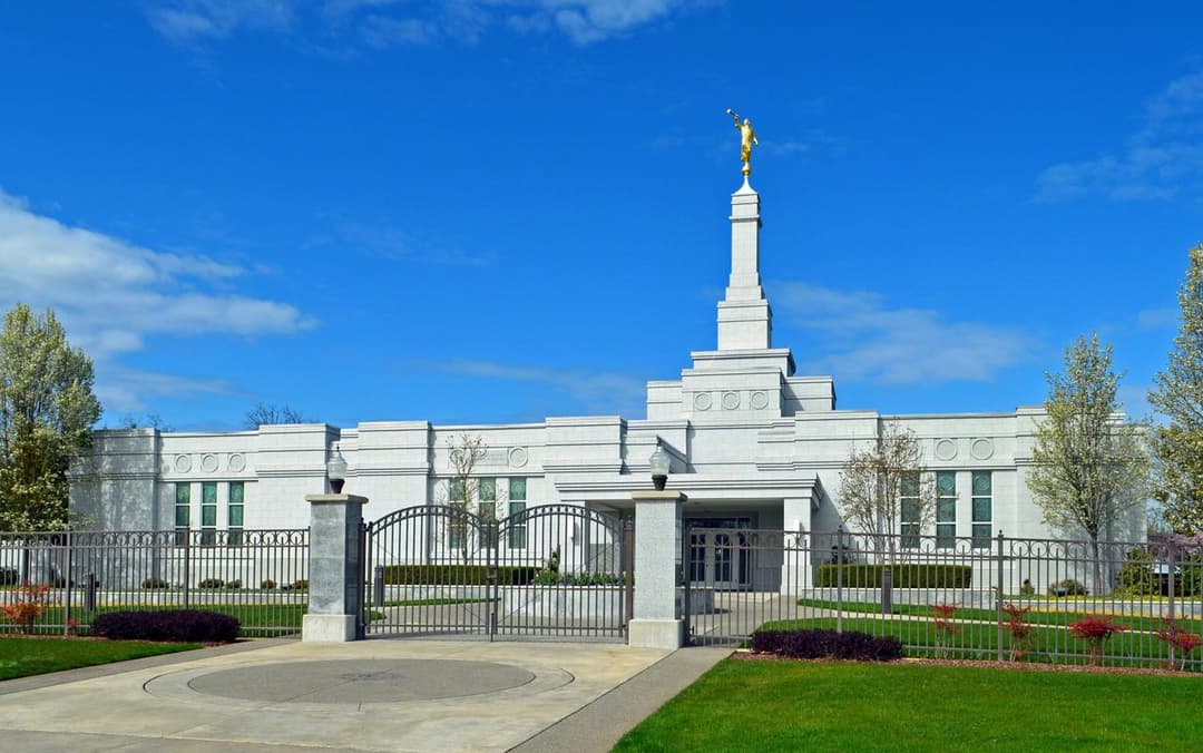 Medford Oregon Temple exterior, spire with Angel Moroni, and entrance gate.