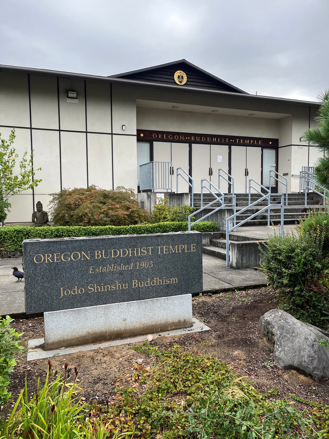 Front entrance and granite sign of the Oregon Buddhist Temple in Portland.