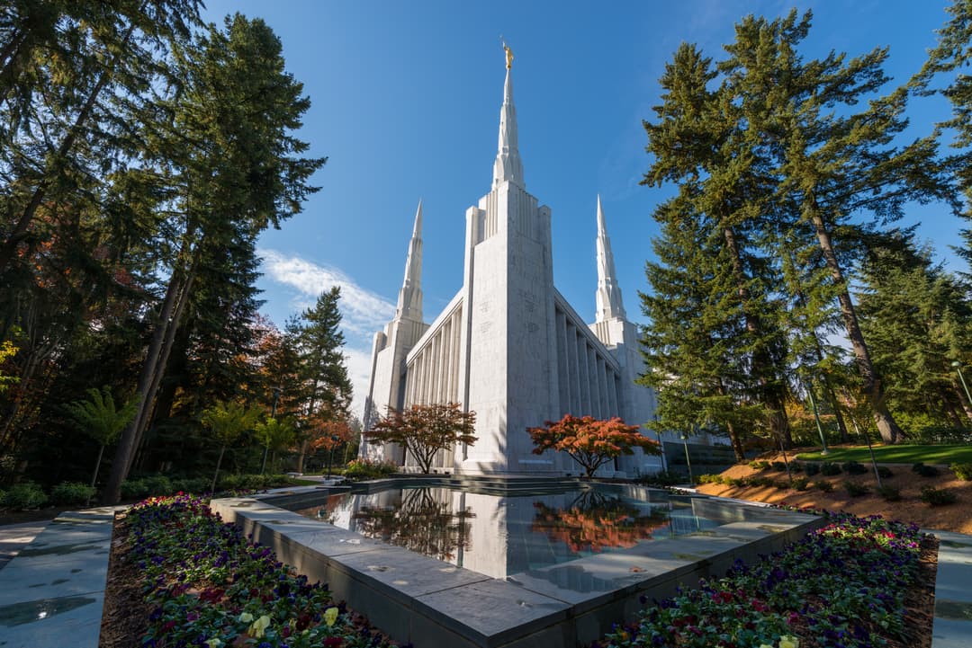 The temple and reflection pool surrounded by Douglas firs and gardens