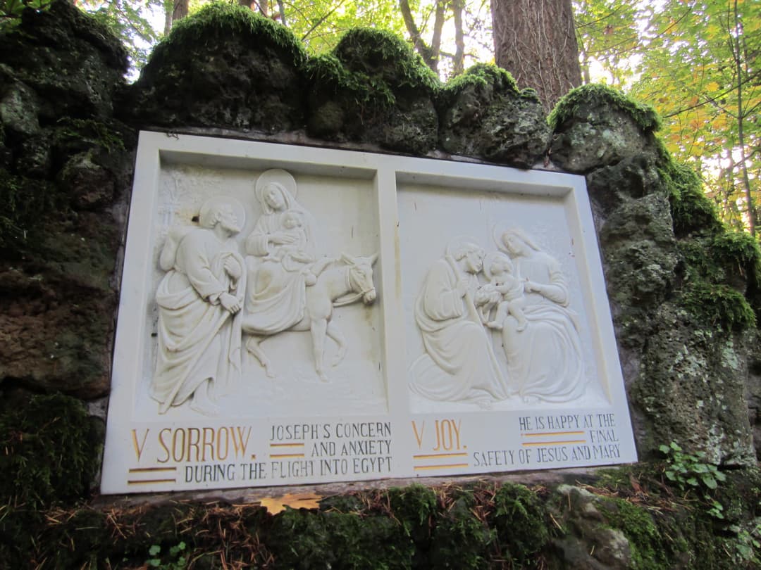 Outdoor relief panel depicting the Fifth Sorrow and Joy of St. Joseph.