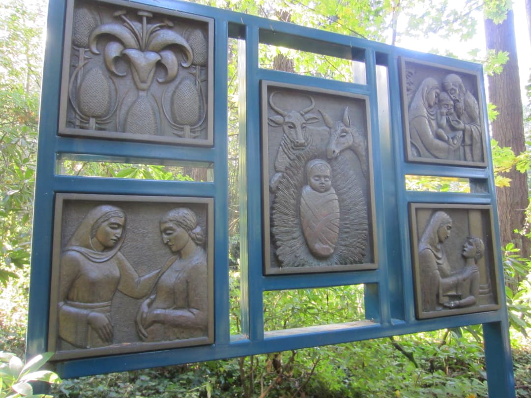 Bronze relief panels displaying biblical scenes on the sanctuary grounds.
