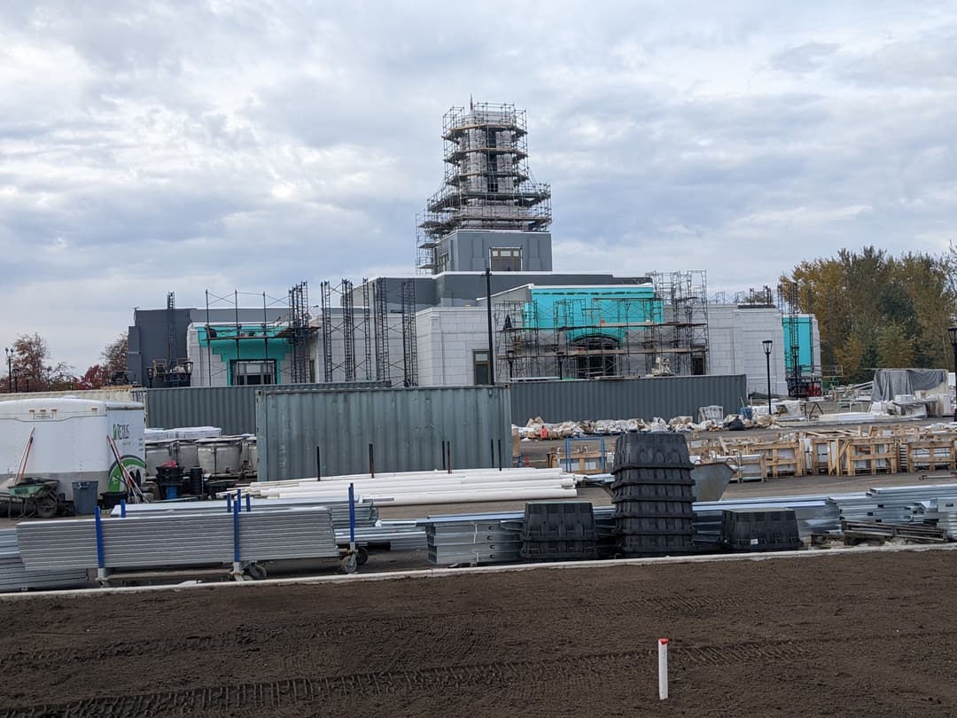 View of the temple and central tower under construction with scaffolding.