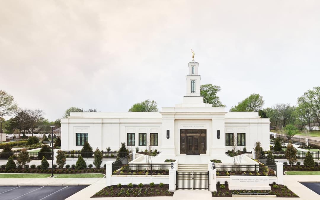 Memphis Tennessee Temple: Front exterior, single spire, and landscaped grounds.