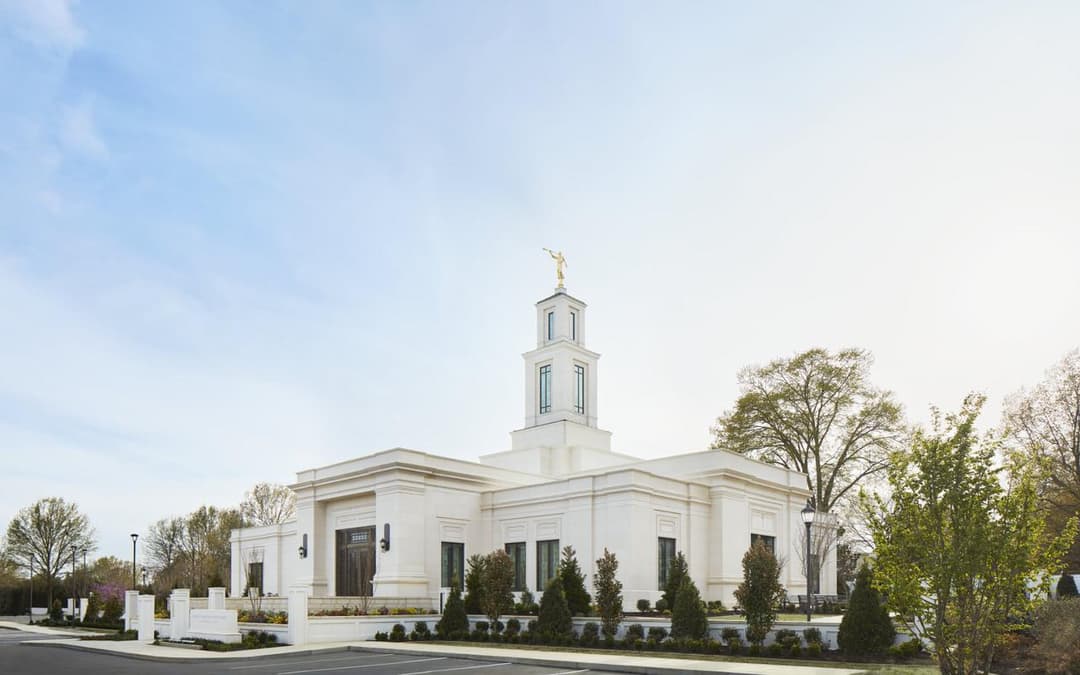 Memphis Tennessee Temple exterior, single spire with Angel Moroni, daytime.
