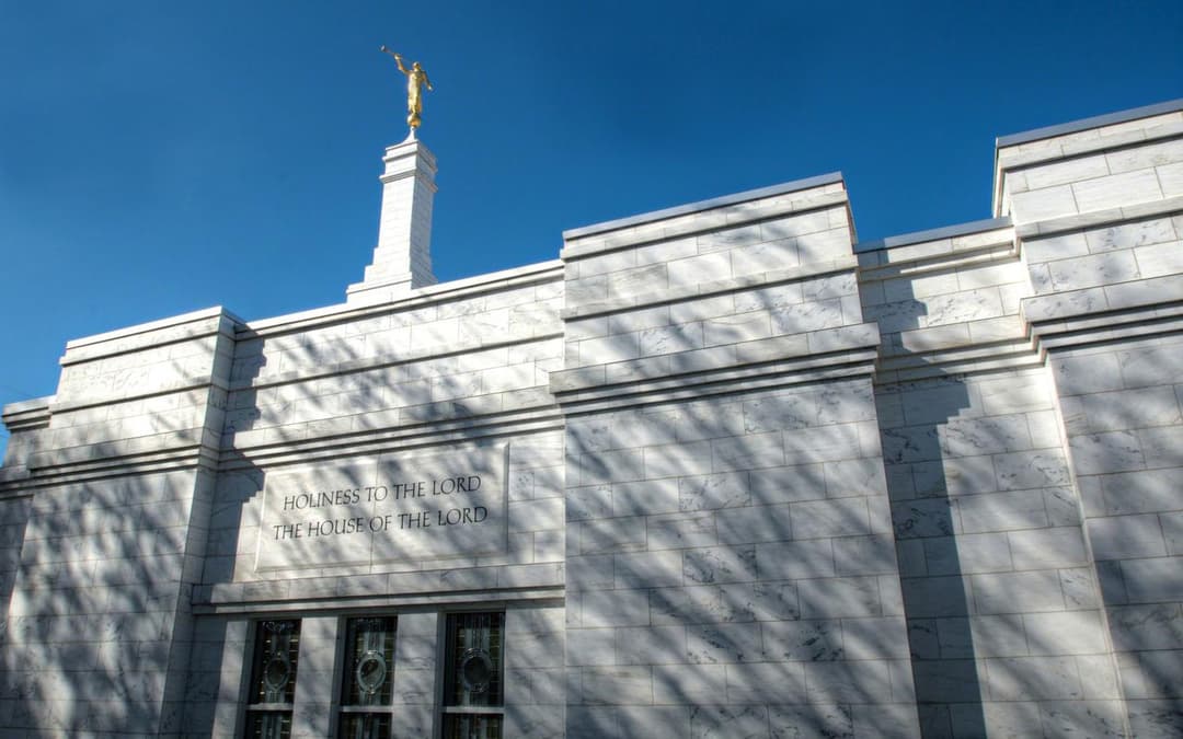 Low-angle view of the Nashville Tennessee Temple facade and Angel Moroni spire.