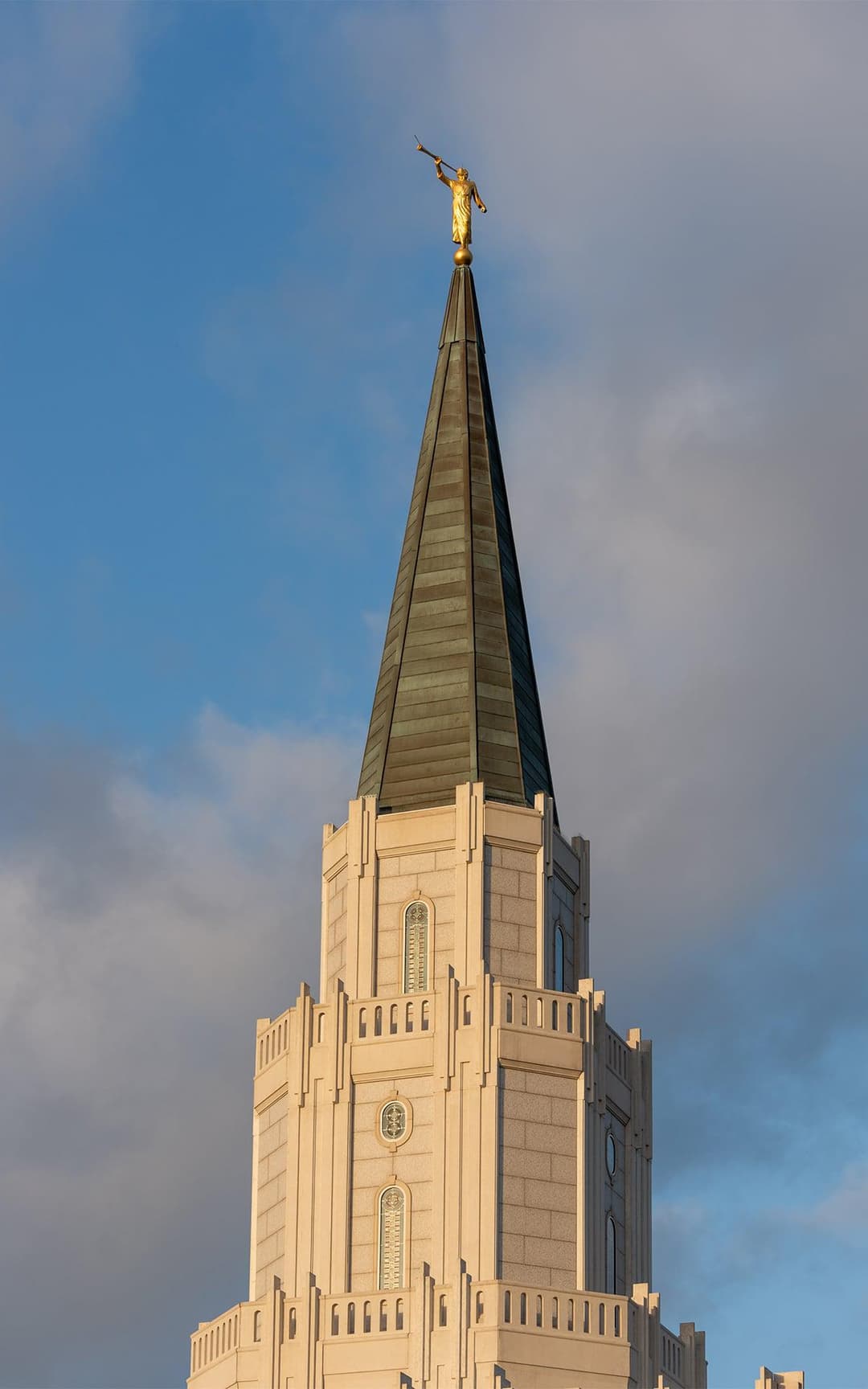 Exterior detail of the spire topped with the golden Angel Moroni statue.
