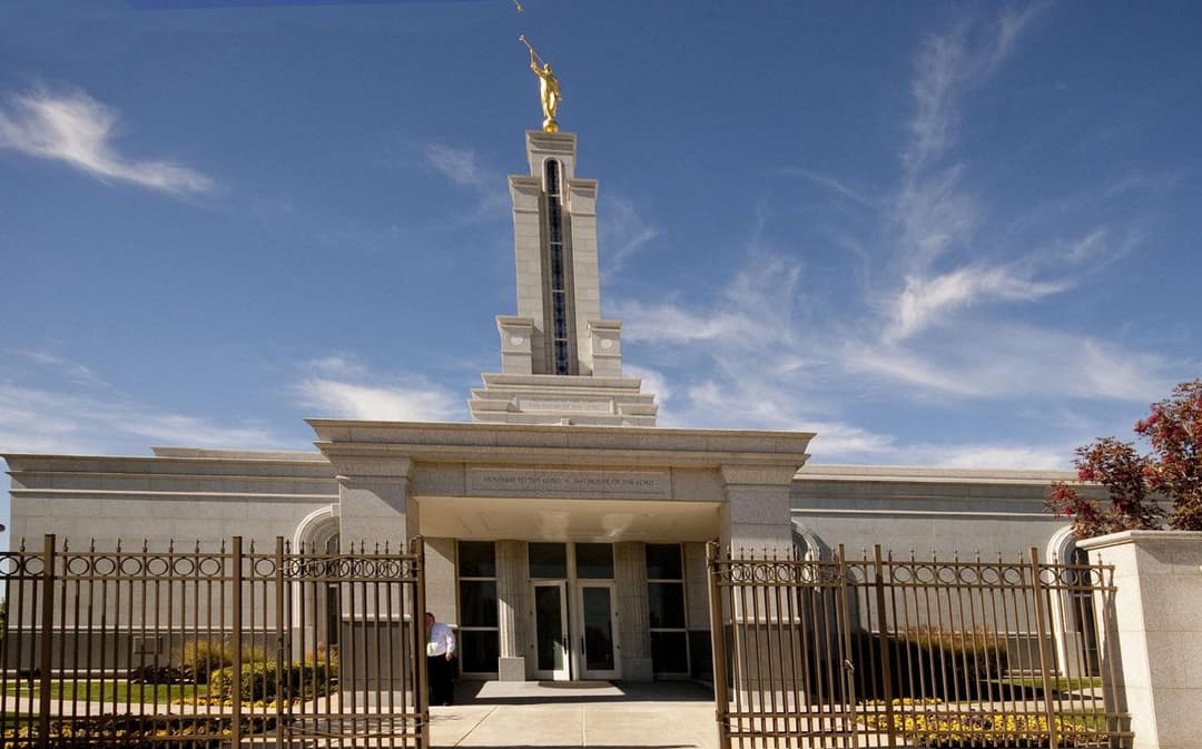 Daytime front view of the Lubbock Texas Temple, featuring the Moroni statue.