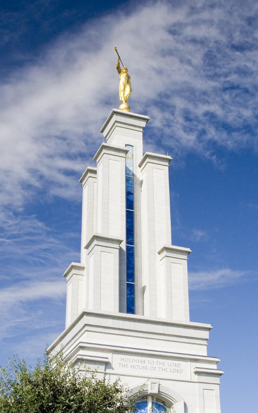 Low-angle view of the spire topped with the golden Angel Moroni statue.