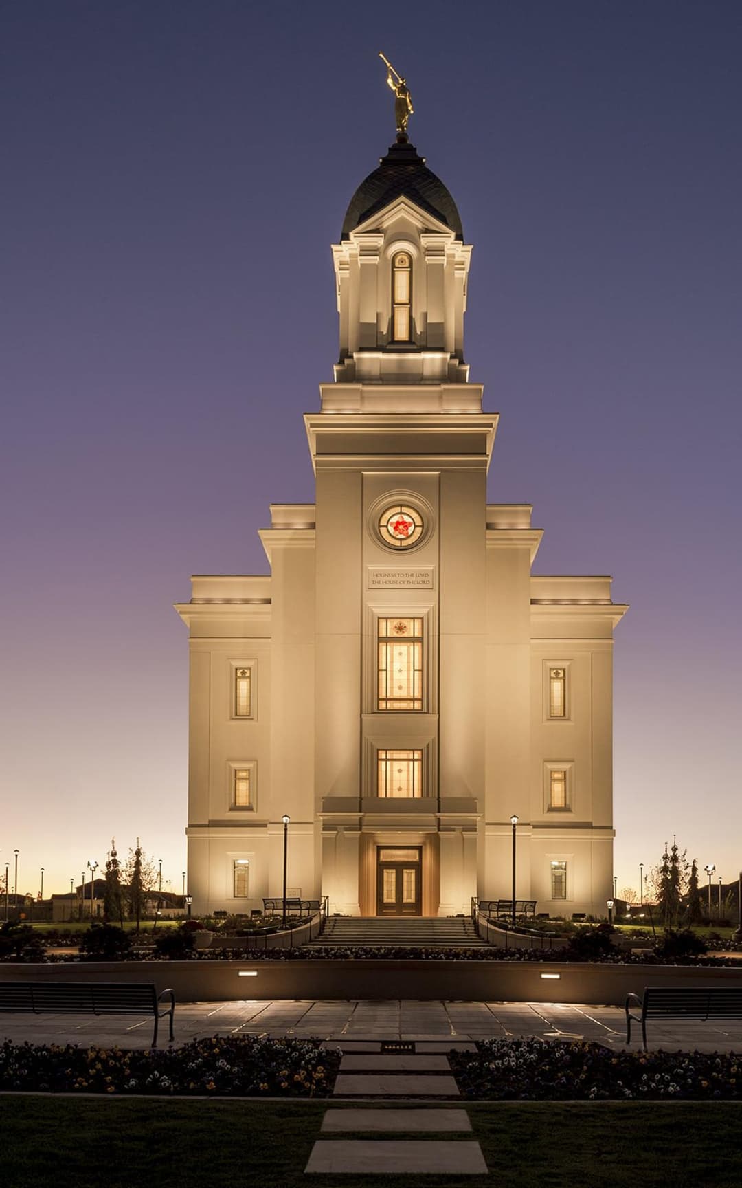 Symmetrical front facade of the Cedar City Utah Temple at twilight.