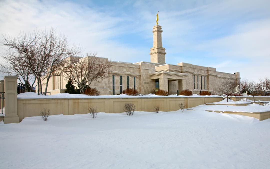 Wide-angle exterior view of the Monticello Utah Temple in winter.