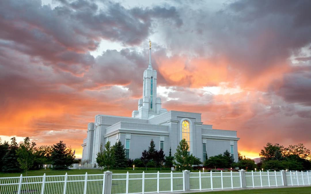 Exterior view of the Mount Timpanogos Utah Temple at sunset.