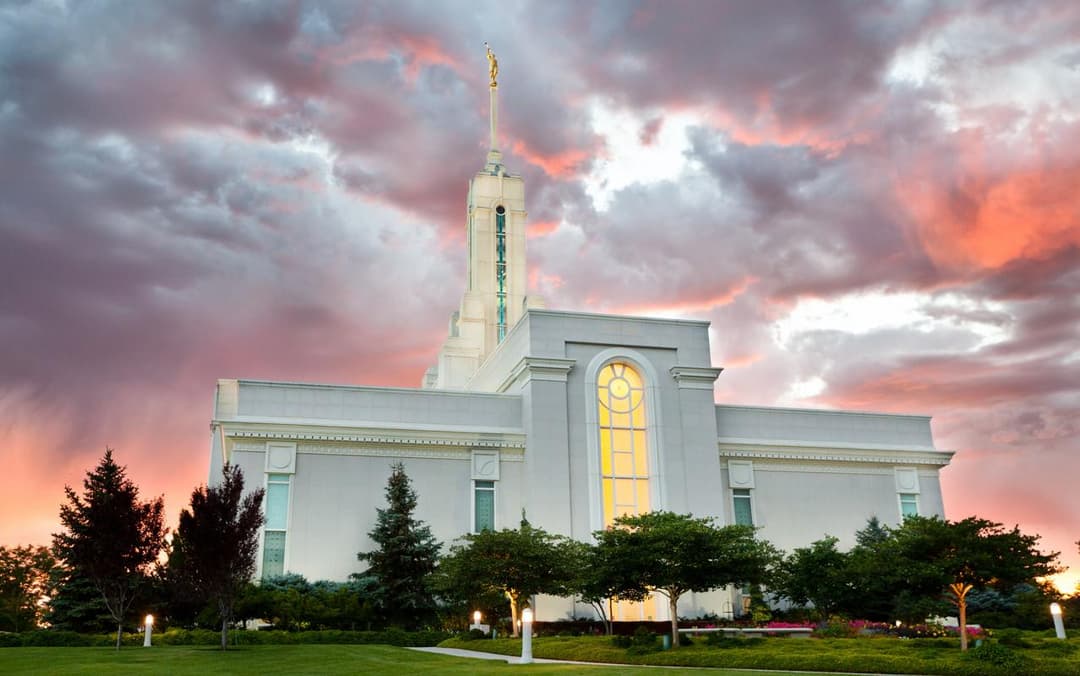 Exterior view of the Mount Timpanogos Utah Temple at sunset.