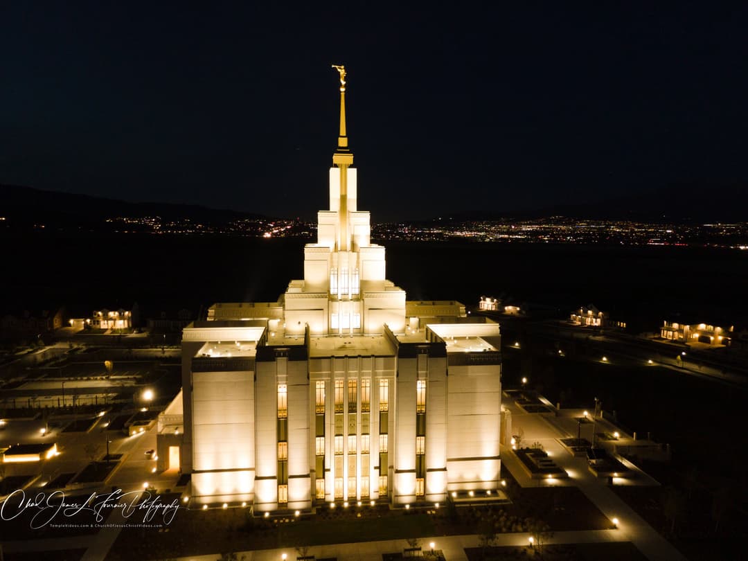 Night aerial view of the illuminated Saratoga Springs Utah Temple.