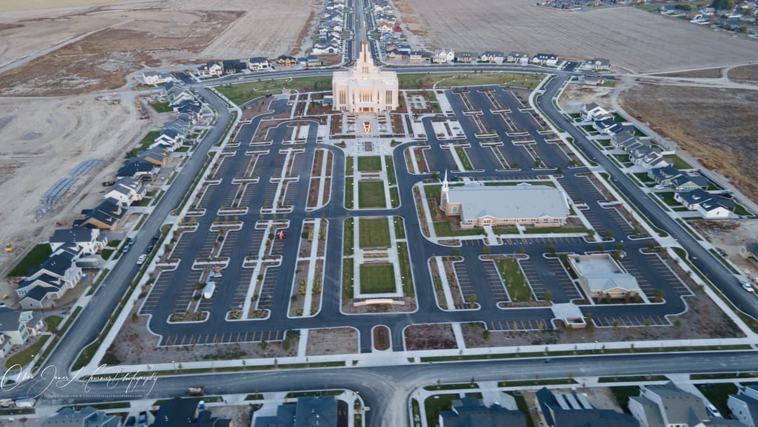 Aerial view of the Saratoga Springs Utah Temple grounds at dusk.