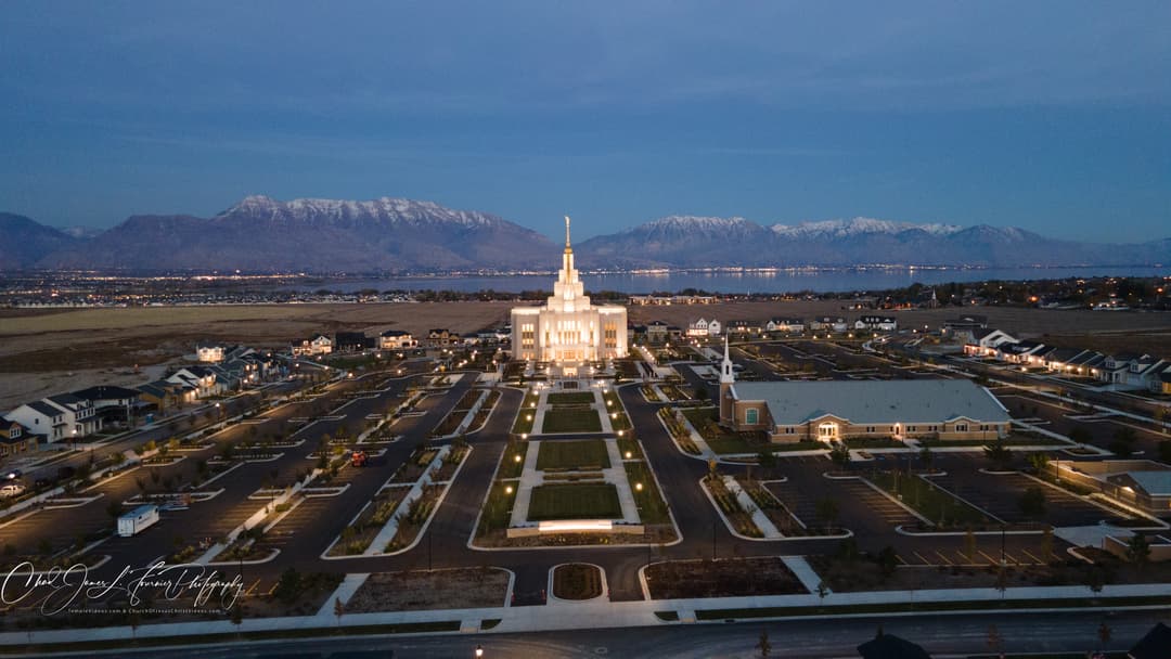 Aerial view of the Saratoga Springs Utah Temple at twilight.
