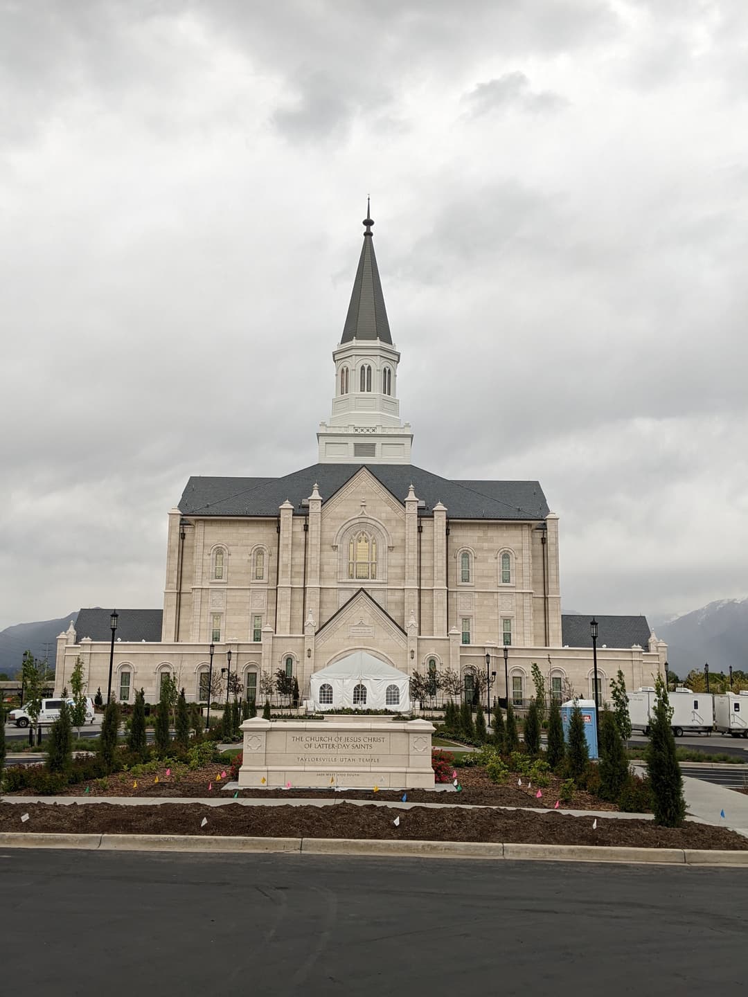 Symmetrical front view of the Taylorsville Utah Temple under an overcast sky.