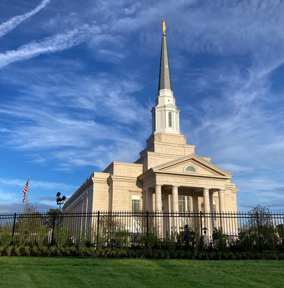 Angled exterior view of the Richmond Virginia Temple featuring its tall spire.