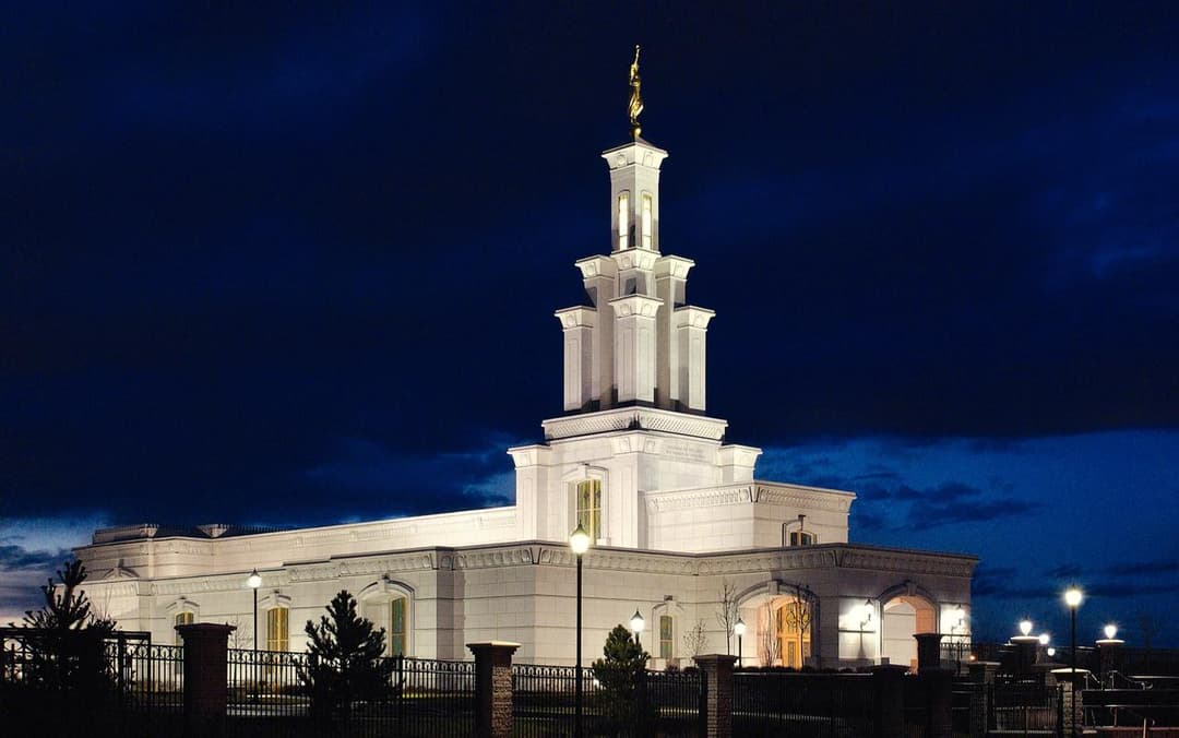 The illuminated Columbia River Washington Temple at twilight.