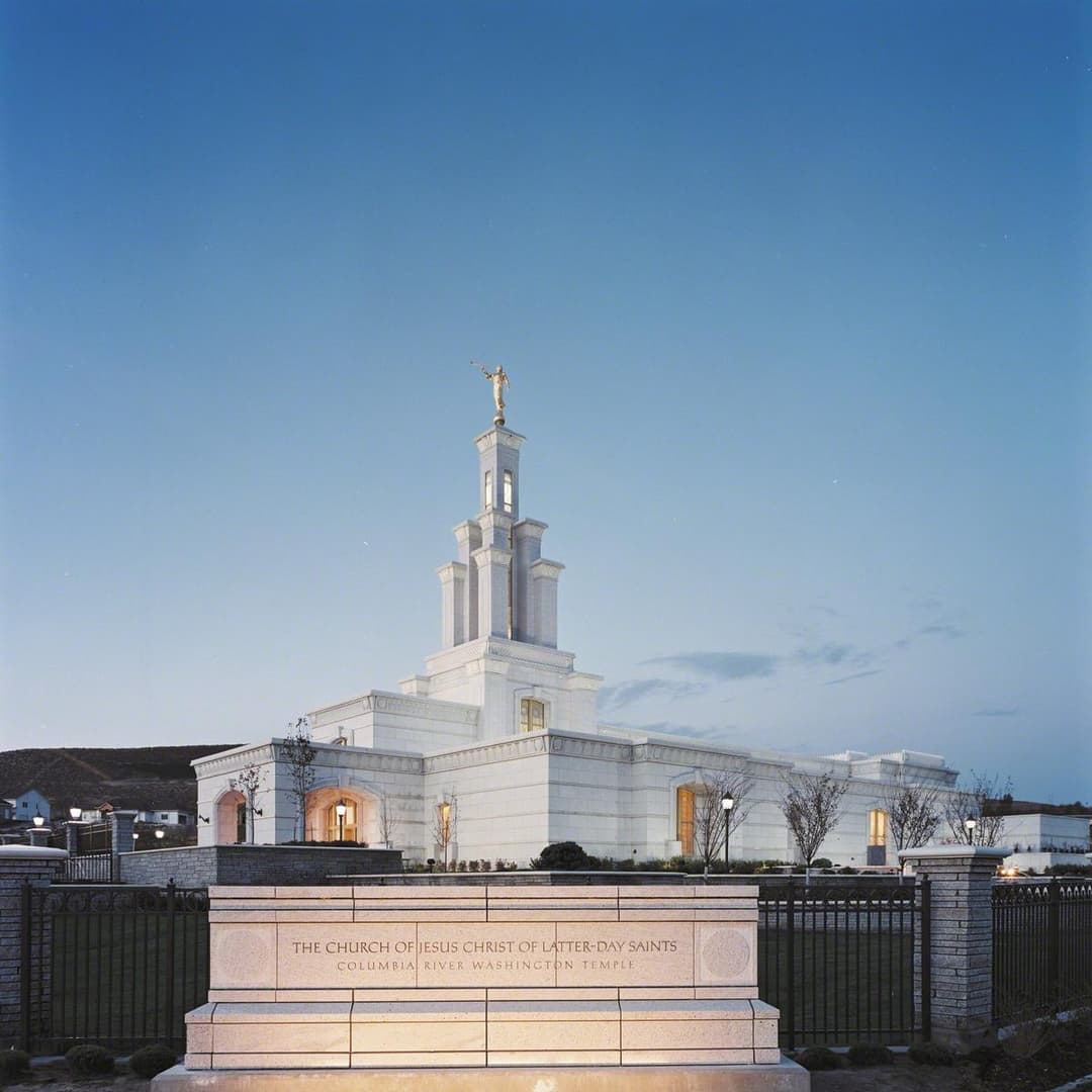 Columbia River Washington Temple and entrance sign at twilight.