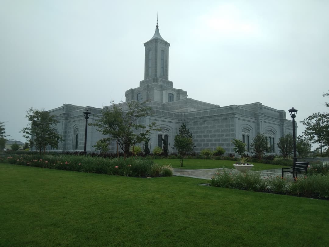 Moses Lake Washington Temple, central spire, and grounds on an overcast day.
