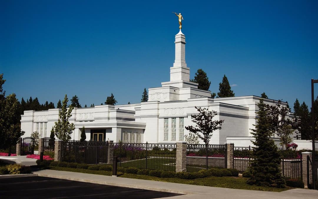 Daytime exterior view of the Spokane Washington Temple and spire.