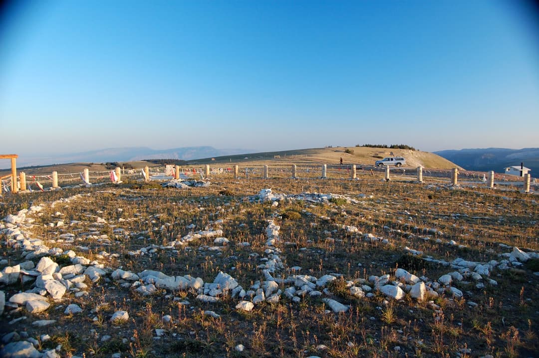 Limestone spokes and cairns of the Medicine Wheel in low sunlight.