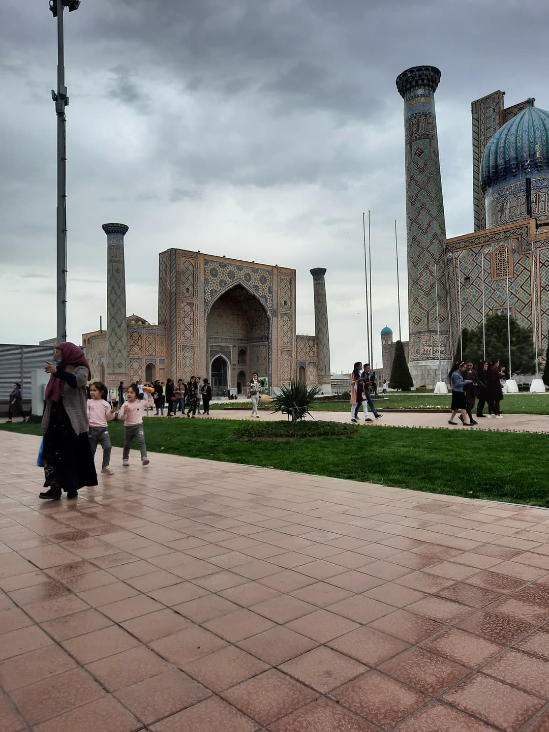 View across the Registan grounds towards the madrasahs on an overcast day.