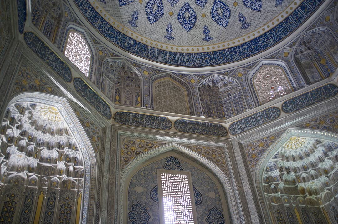 Interior view of the ornate dome and muqarnas squinches