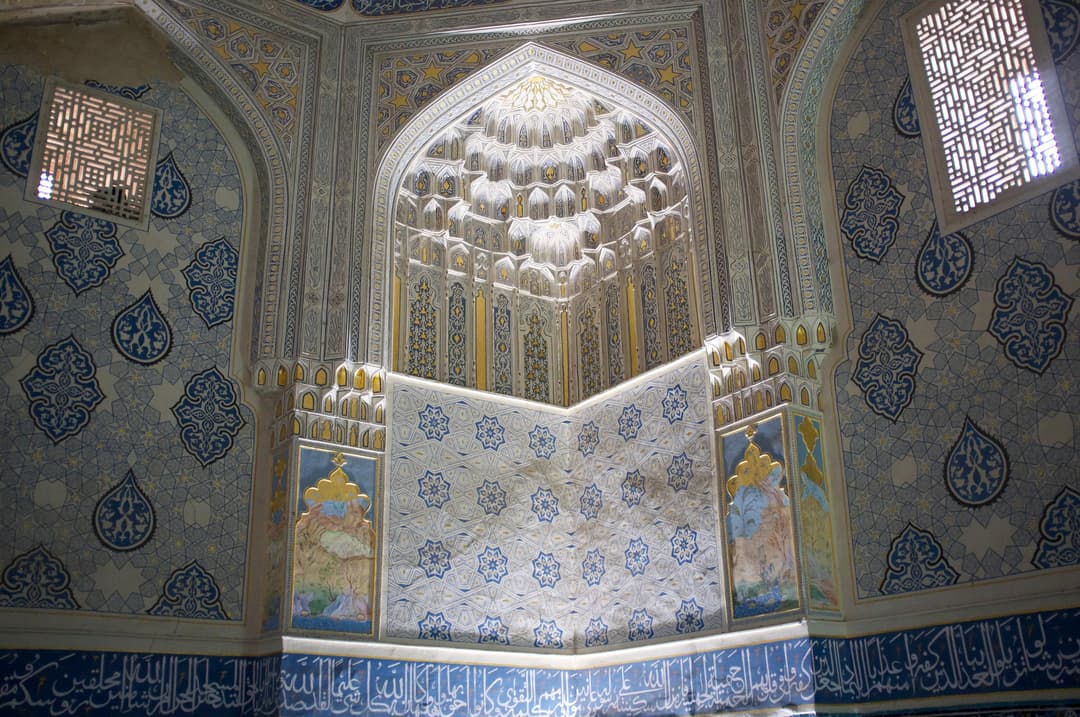 Interior view of ornate muqarnas niche and tilework at Shah-i-Zinda