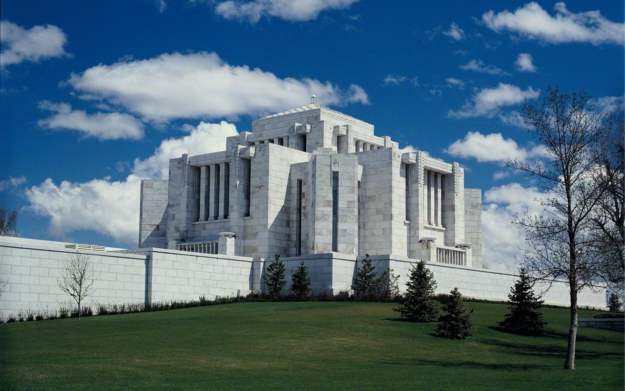 The temple's unique architecture stands out against the prairie sky.