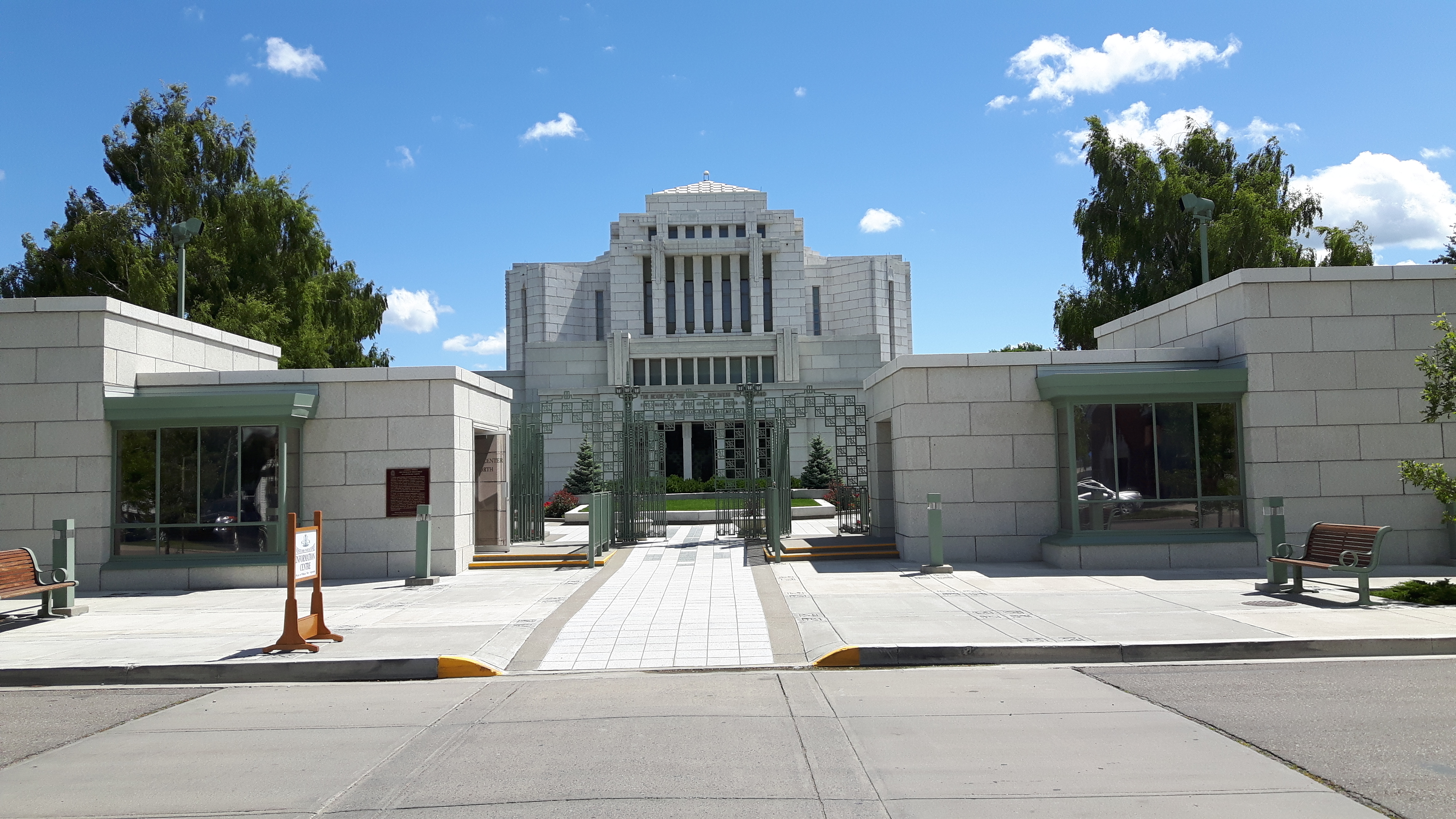The temple's grounds are beautifully landscaped with flowers and trees.