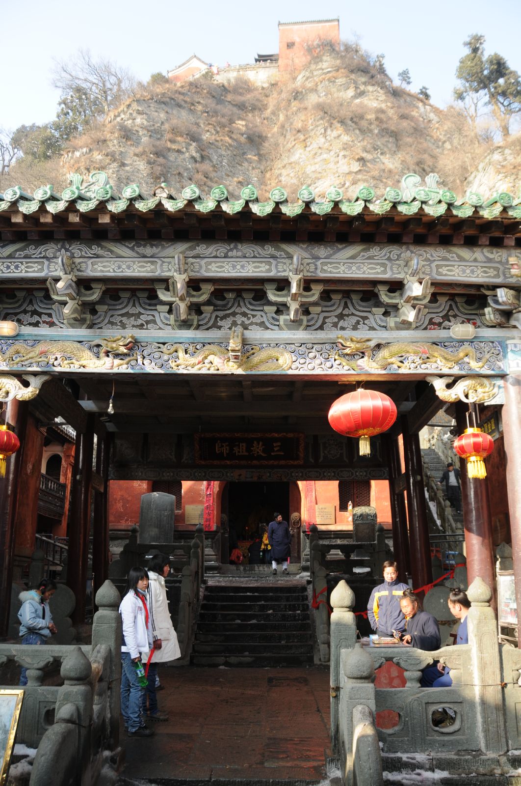 The Wudang Mountains temple structures integrated into the forested mountainside.