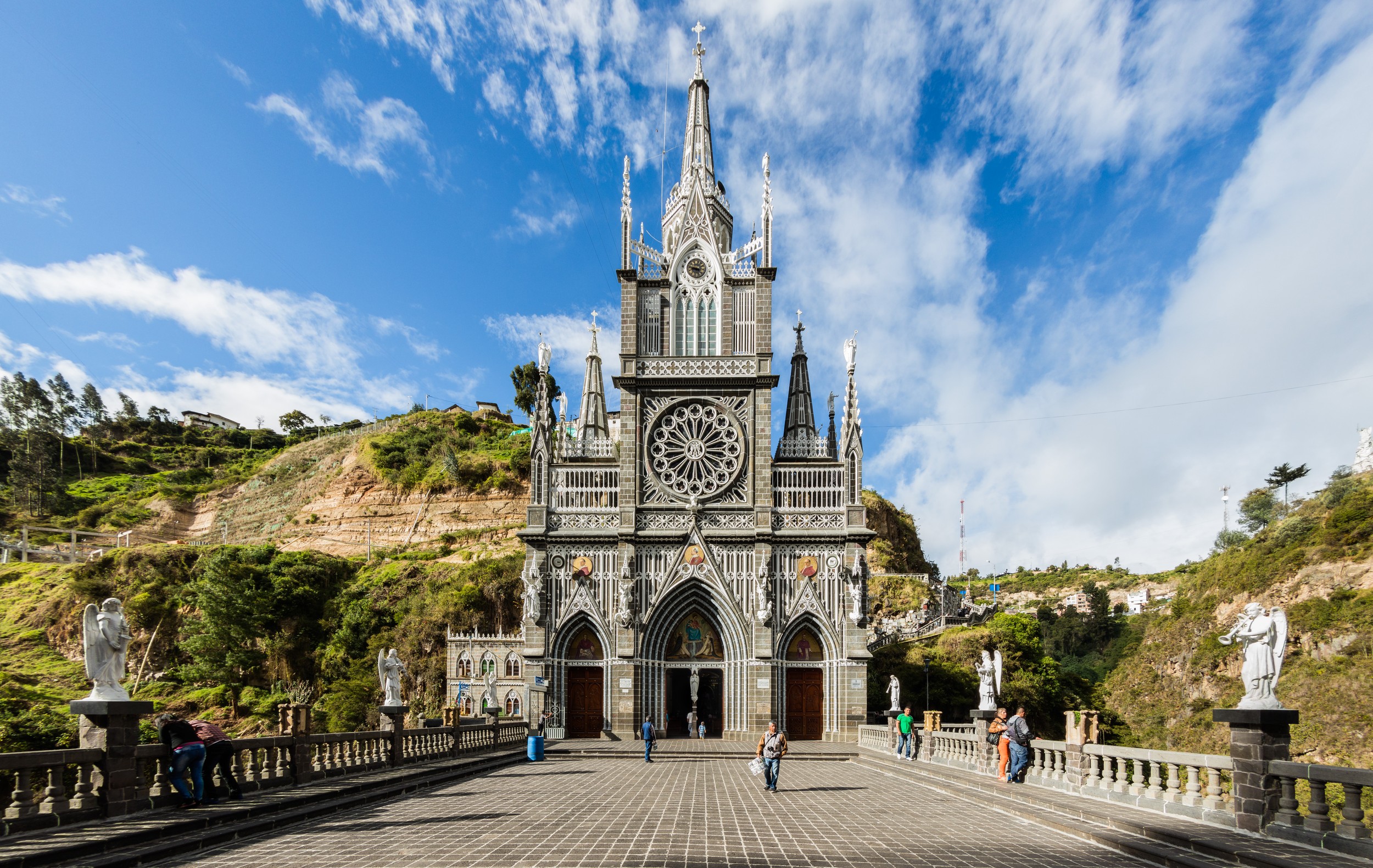 Exterior view of the Sanctuary of Las Lajas nestled in the canyon.