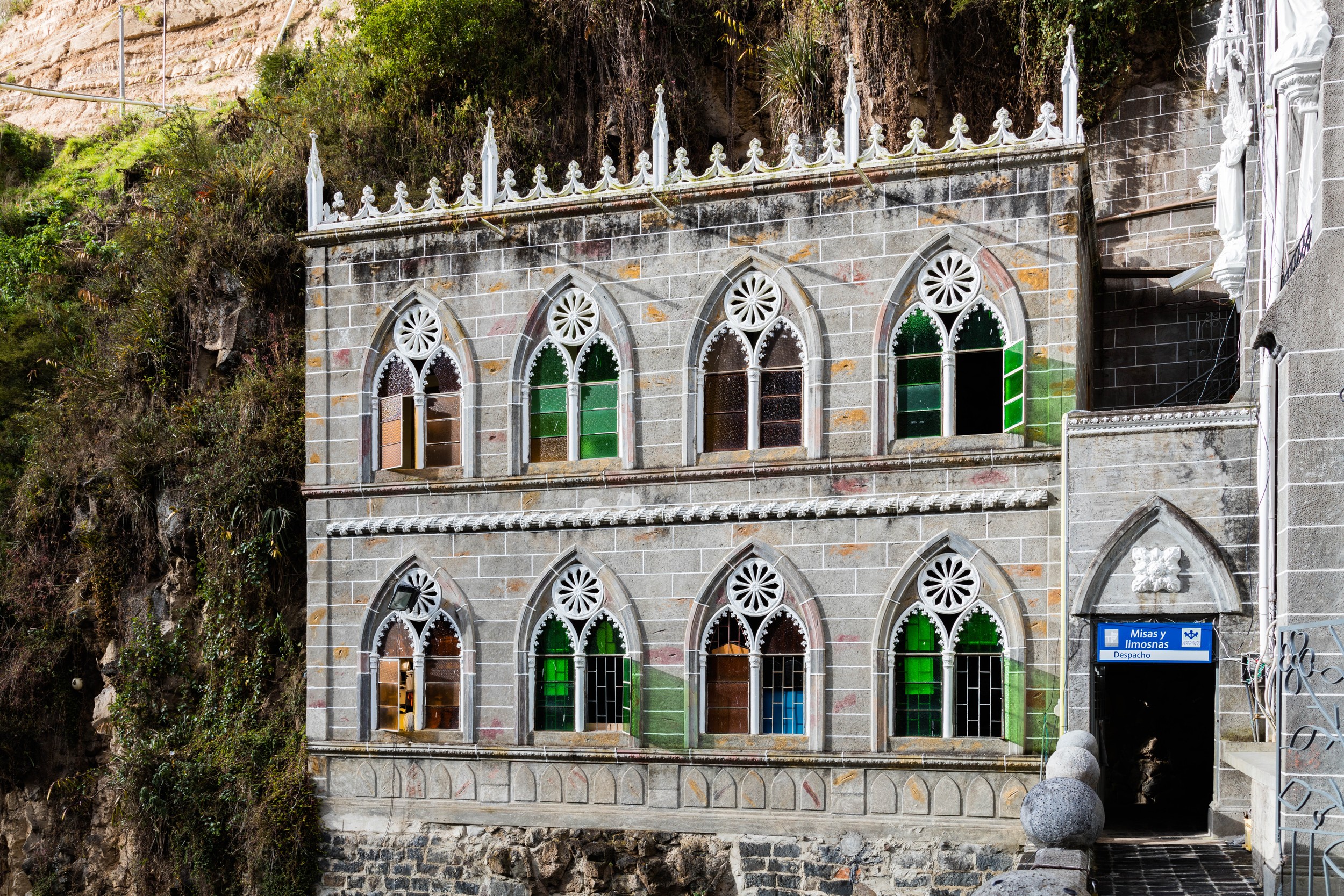 The stained-glass windows of the sanctuary depict biblical scenes.