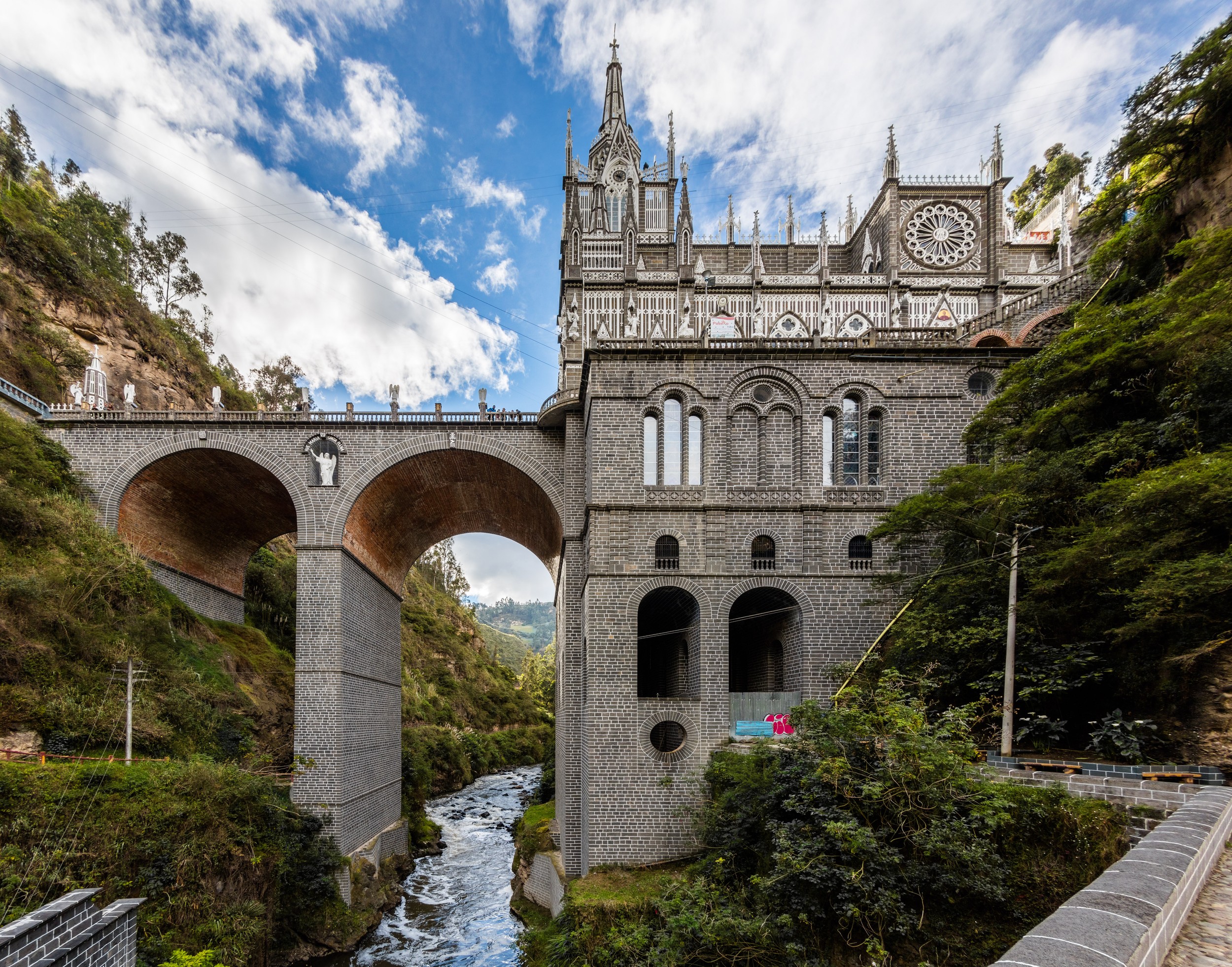 The Guáitara River flows beneath the basilica, adding to its dramatic setting.