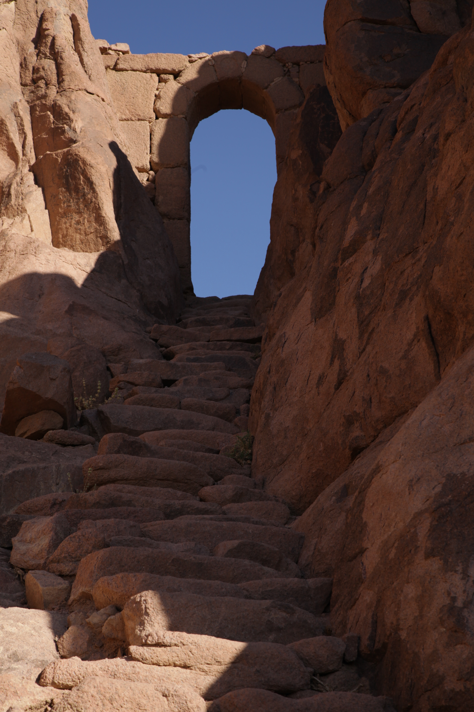 Pilgrims praying at the summit of Mount Sinai.