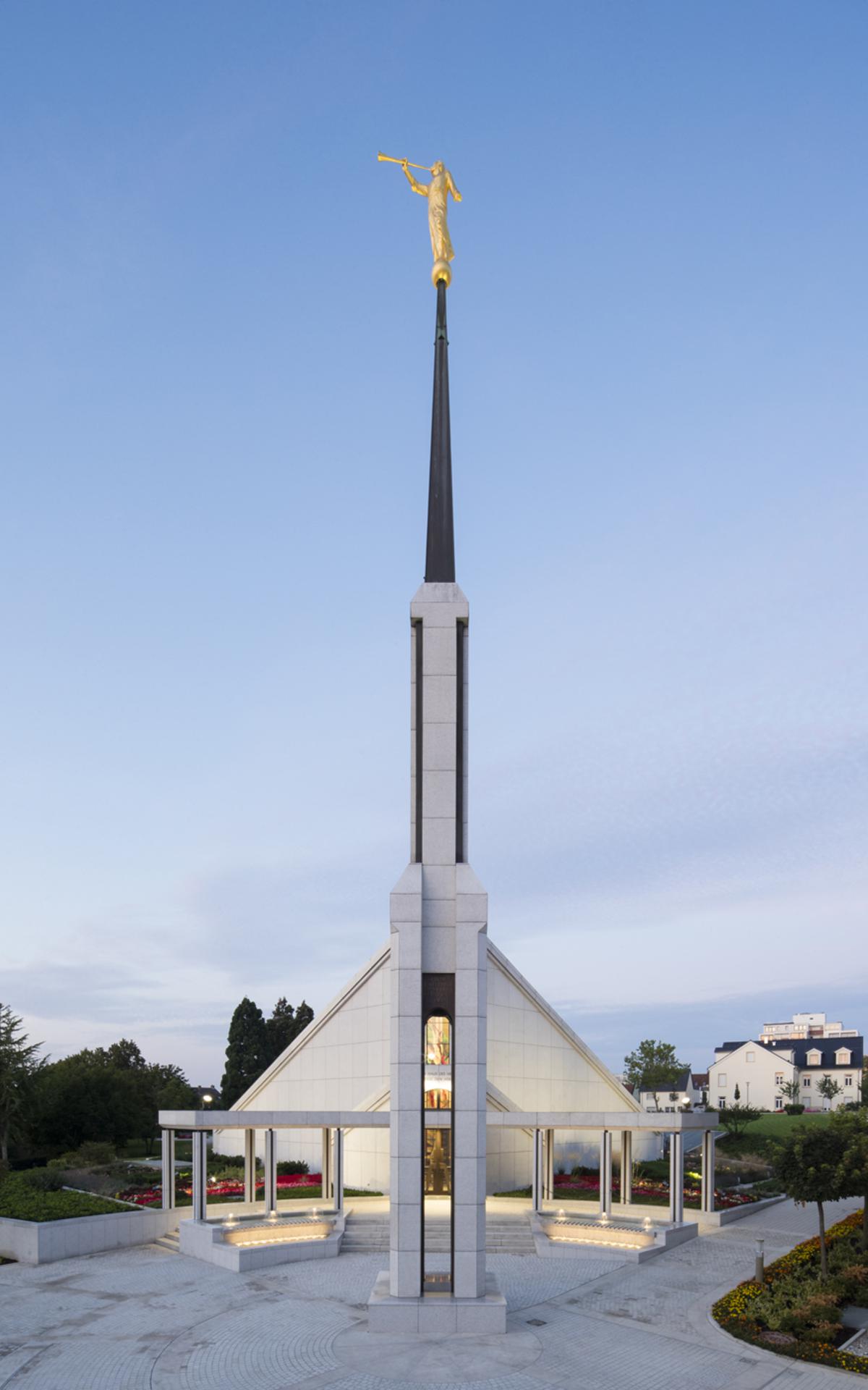 The Frankfurt Germany Temple surrounded by lush greenery.