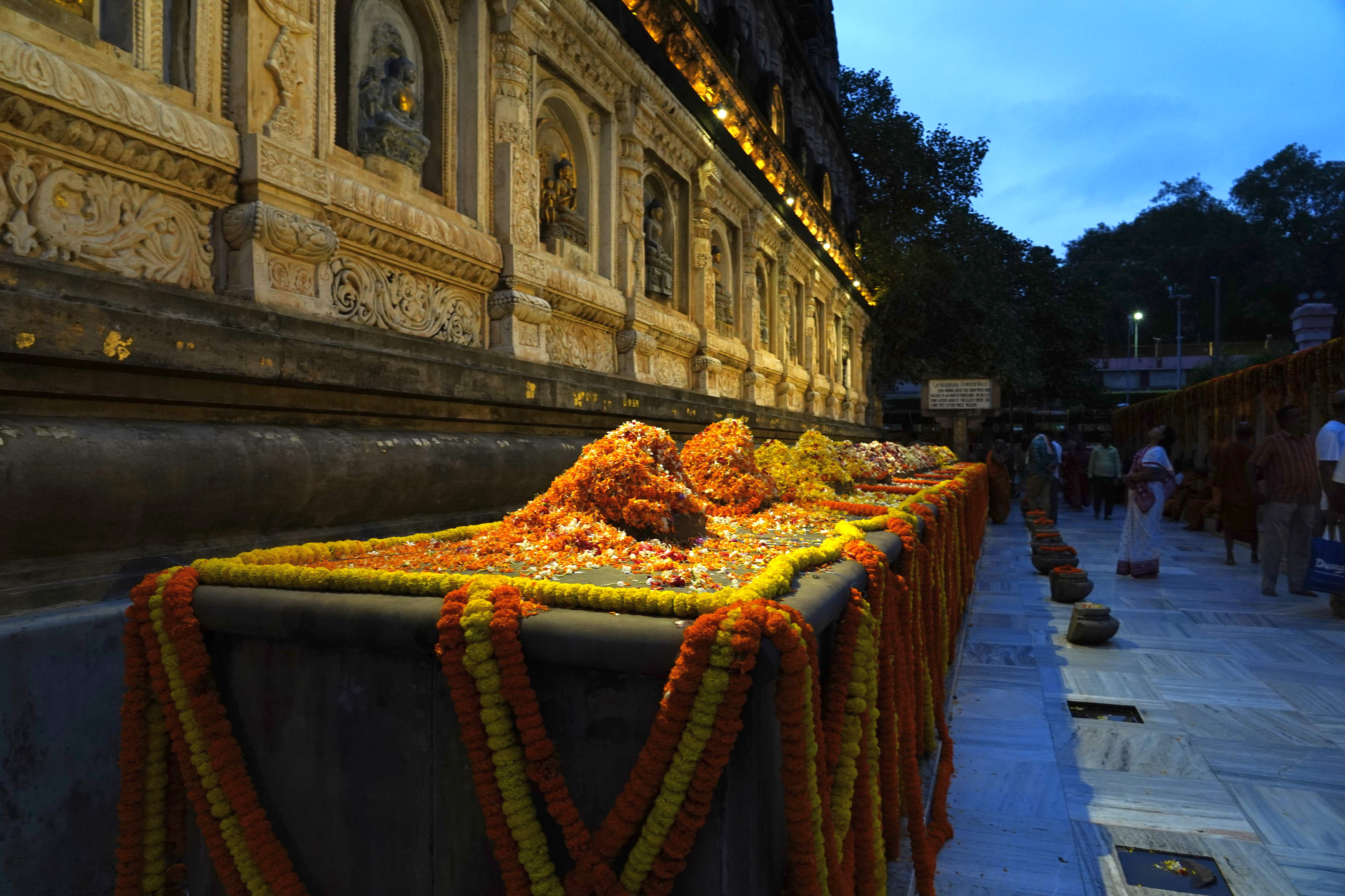 The ancient stone railings surrounding the Mahabodhi Temple.