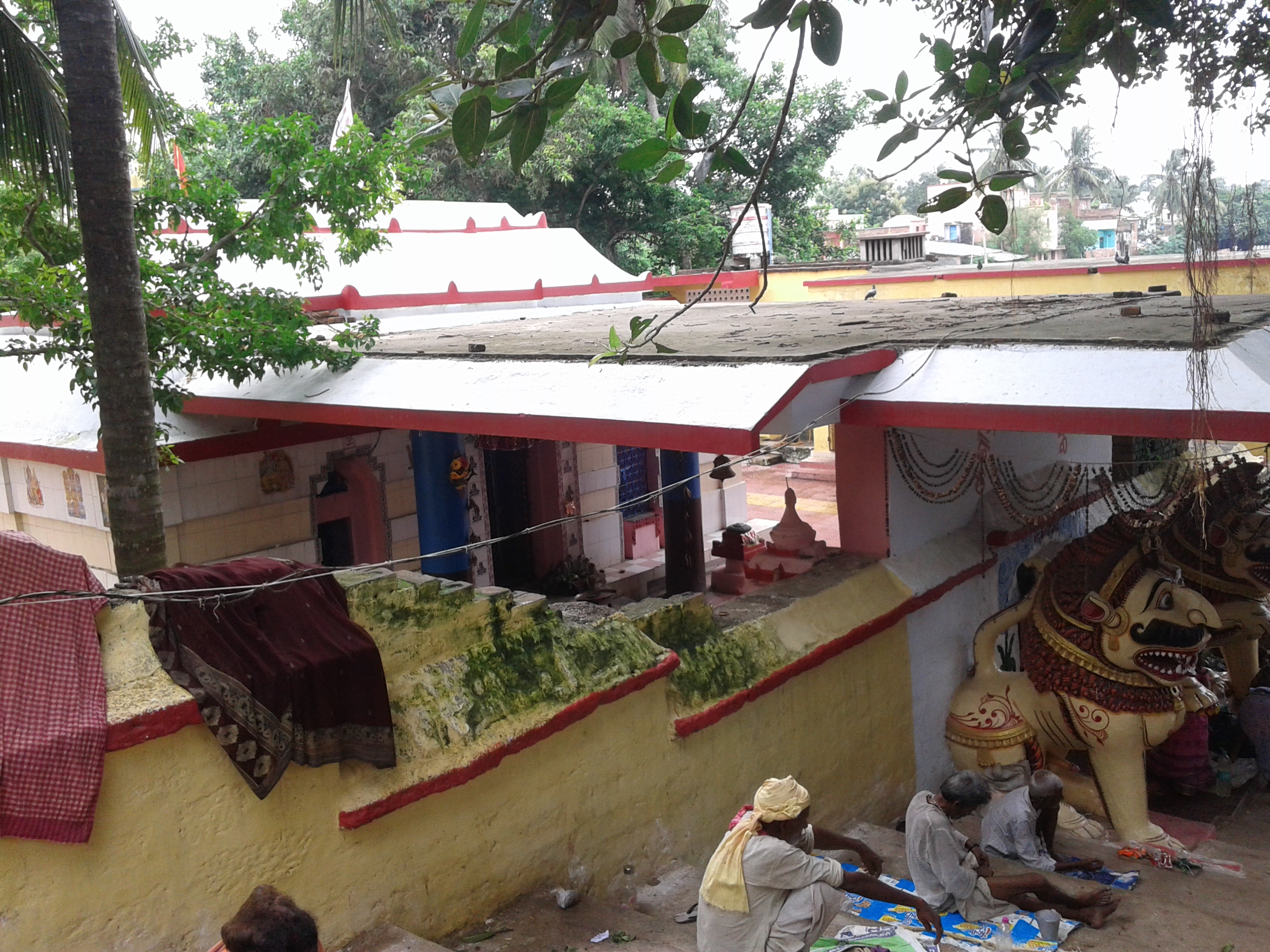 Devotees gather at a sacred ghat in one of the Sapta Puri, participating in religious rituals and prayers.