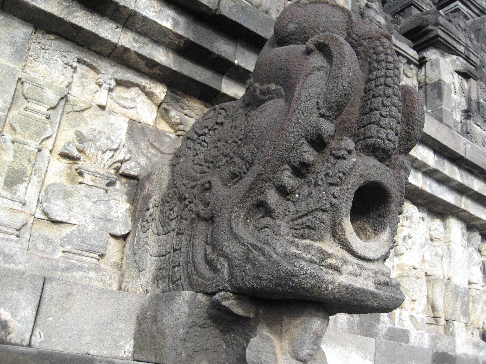 One of the many bell-shaped stupas, each containing a seated Buddha statue.