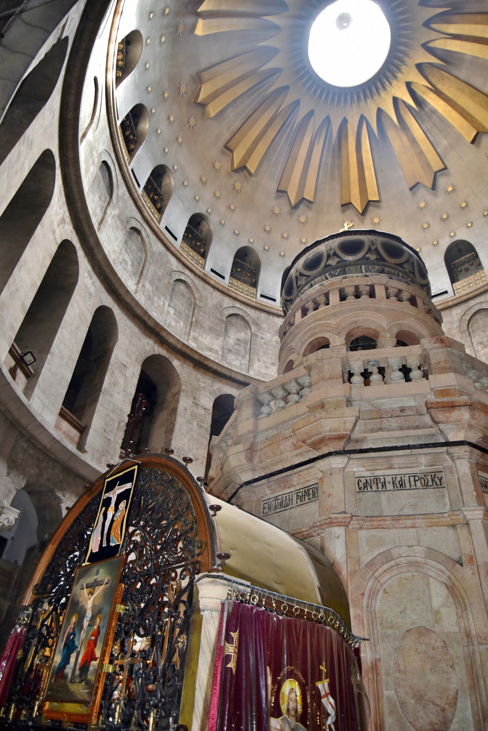 Pilgrims praying at the Stone of Anointing.