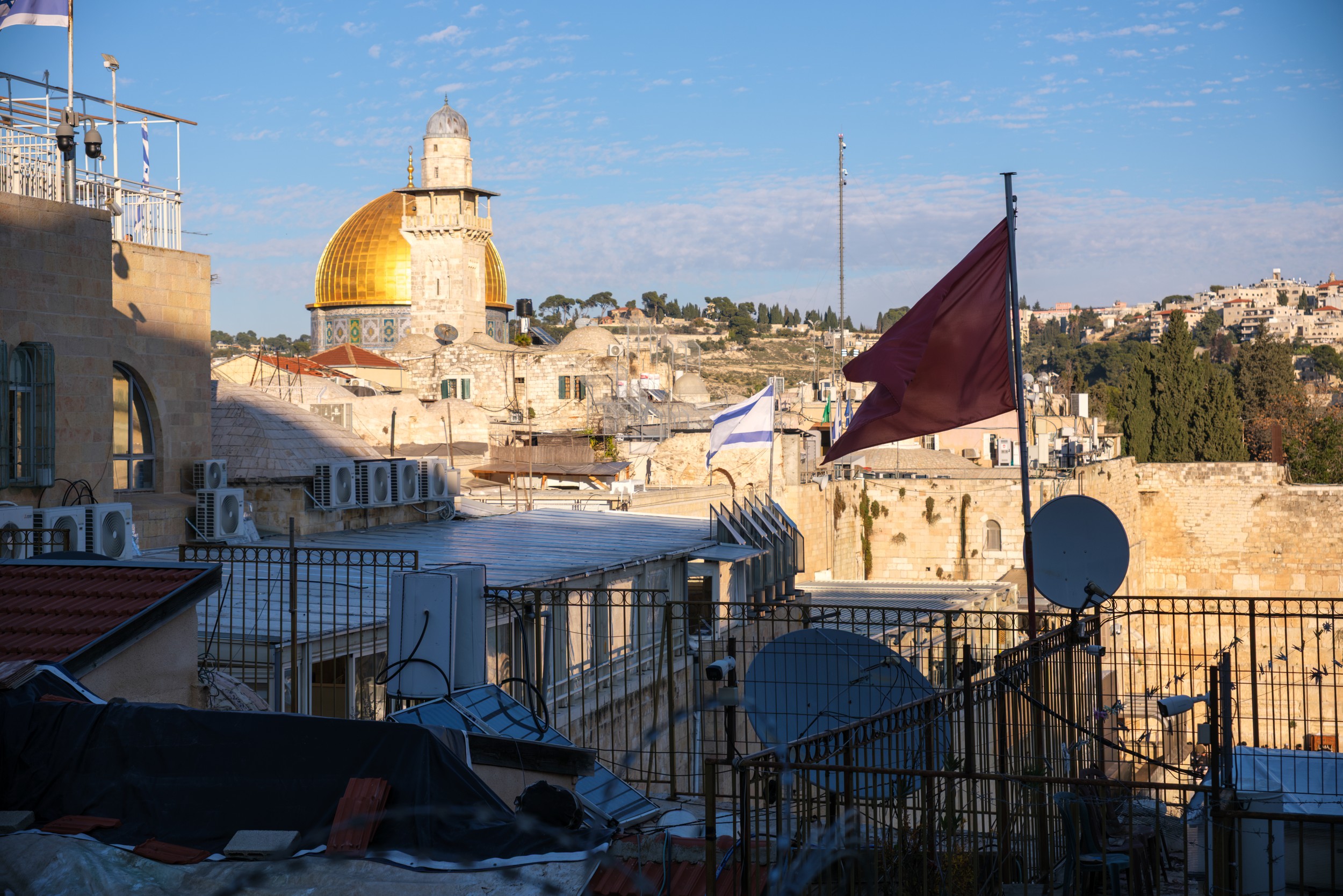 Exterior view showcasing the golden dome and intricate tilework.