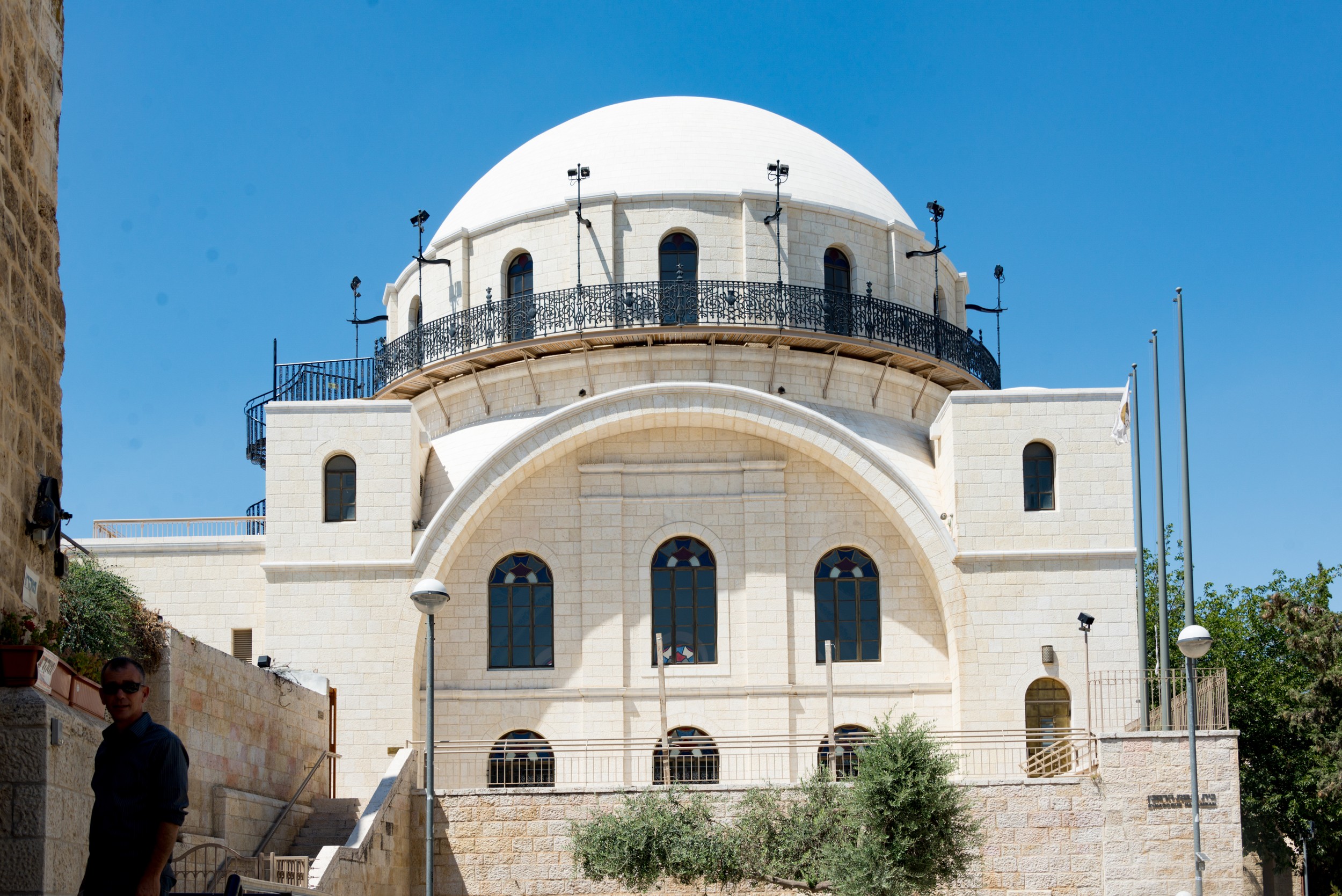 The Hurva Synagogue at night, illuminated against the dark sky.