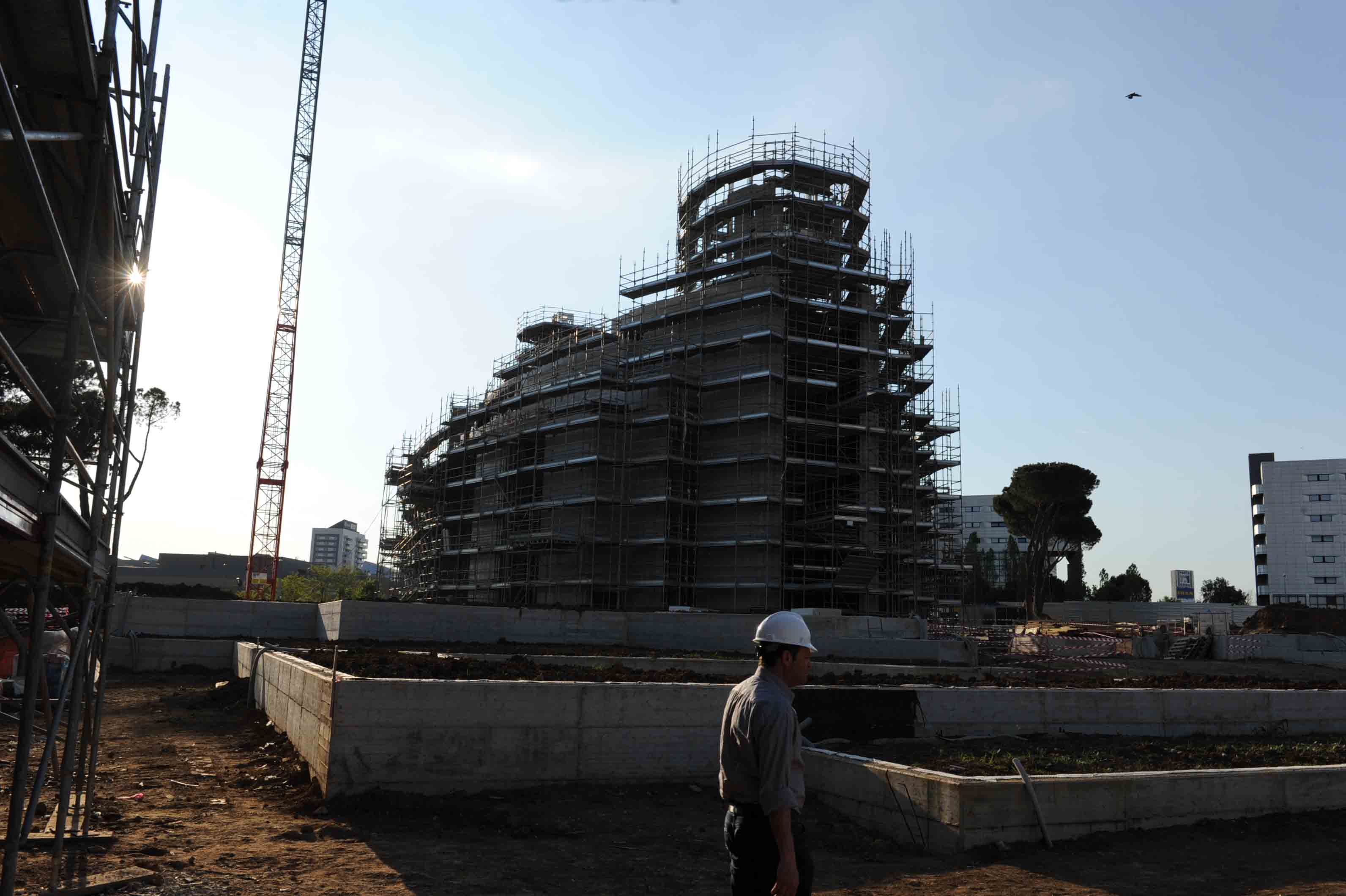 Construction progress showing the structural frame and crane (2013)